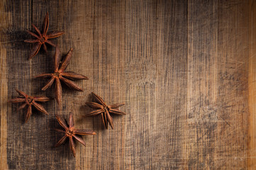 STAR ANISE ON WOODEN BACKGROUND, MACRO PHOTOGRAPHY OF GARAM MASALA ON WOODEN TEXTURE BACKGROUND, 