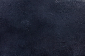 An abstract black slate background, a dark texture with copy space