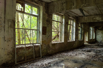Fototapeta na wymiar Broken windows in a large workshop. Large windows in the room.