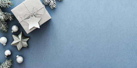 Christmas silver handmade gift boxes on blue background top view. Merry Christmas greeting card, frame. Winter xmas holiday theme. Happy New Year. Flat lay
