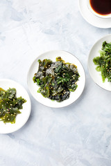 Various seaweed, sea vegetables, shot from the top on with a place for text. Superfoods background