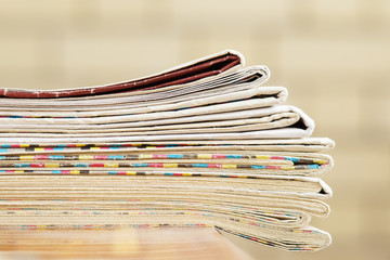 Stack of Newspaper on Table     