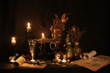 Witchcraft Peacock feathers and candle background.