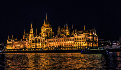 Fototapeta na wymiar Hungarian Parliament Building and Danube River in Budapest. Night cityscape
