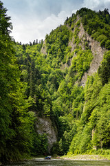 Floating along Dunajec river in Pieniny National Park, Poland, Dunajec river - popular tourist spot for boat rafting in Poland