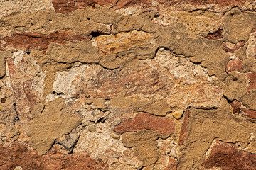 texture old weathered house wall stones and mortar