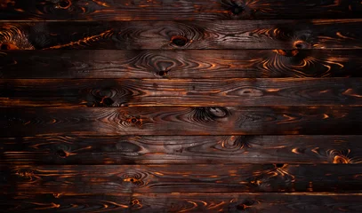 Rolgordijnen Verbrande houten plank, zwarte houtskool houtstructuur, verbrande barbecue achtergrond © xamtiw
