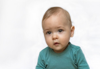 Naklejka premium Sweet little baby boy portrait on white background