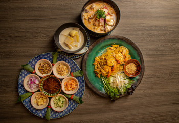 Thai food on the wooden board.
