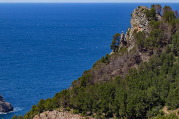 Fototapeta na wymiar Scenic view at landscape of Serra de Tramuntana on island Mallorca, Spain on a sunny day with rocks and mediterranean sea in background