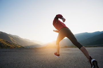 Shot of a beautiful adult woman training at sunrise.
