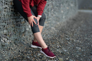 Injuries - sports running knee injury on woman.