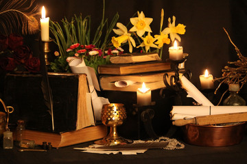 Witchcraft Peacock feathers and candle background.