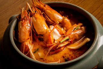 Tomyum on the​ green bowl.