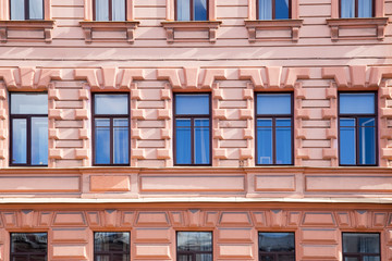  windows and details on an exterior of the building.