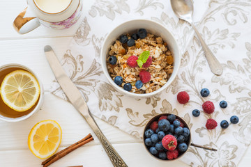 breakfast oatmeal with raspberries and blueberries with tea and honey lemon diet slimming healthy food