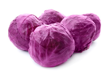 Whole ripe red cabbages on white background