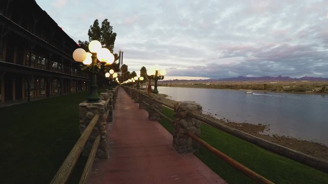 Lighted Riverwalk River And Water Taxi At Dusk- Laughlin Nevada