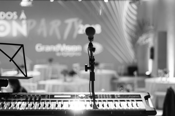 Microphone stand on the stage with blurry background