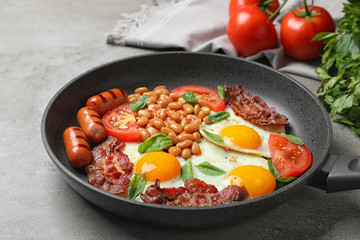 Delicious breakfast with fried eggs served on table, closeup