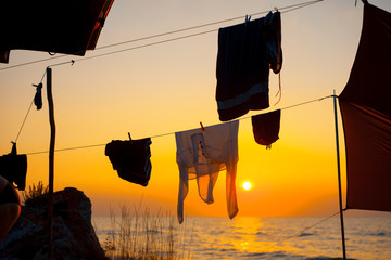 Clothes driing at sunset on the sea shore