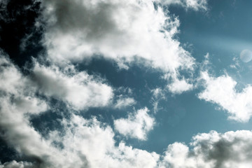 White fluffy clouds on a dark background