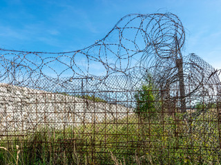 Fragment of barbed wire mounted above prison fence, Rummu quarry, Estonia