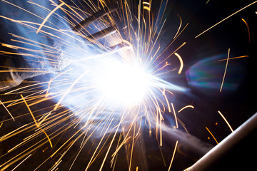 Welding sparks and smoke worker robot