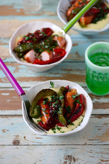 Creamy polenta with chicken sausages and peppers.selective focus