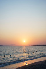 Fototapeta premium Sunset on the sandy beach with sea view. Seascape.