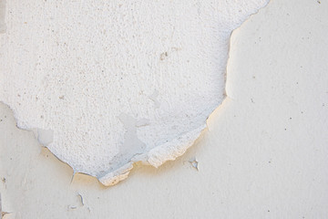 Old cracked paint on the concrete wall. Texture, pattern, background.
