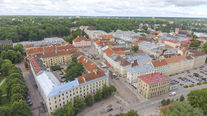 Fototapeta na wymiar Aerial view of Tartu skyline on a cloudy summer day