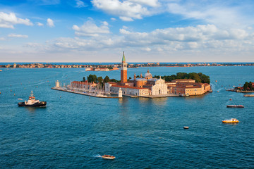 Fototapeta premium Aerial view of Venice lagoon with boats and San Giorgio di Maggiore church. Venice, Italy