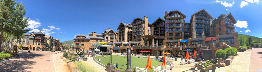 VAIL, CO - JULY 3, 2019: Panoramic view of city streets on a sunny summer day. Vail is a famous tourist destination in Colorado - obrazy, fototapety, plakaty