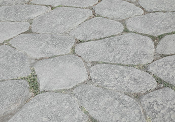 background of old stones of an ancient roman road