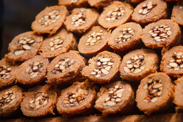 Traditional delicious turkish dessert baklava in the shop window showcase. Different kinds of turkish delights. Popular souvenirs and snacks from Turkey. .