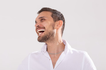 Happy young casual man portrait isolated on white background