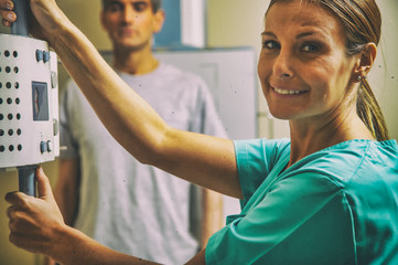 Fototapeta premium Confident doctor with patient at MRI machine
