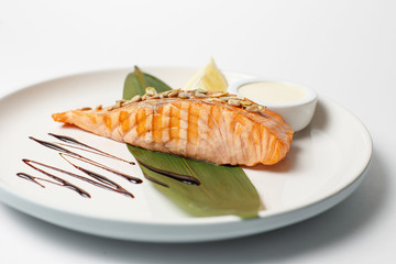 salmon steak or trout with a lemon