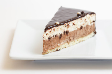 piece of cake on a plate on white background