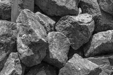 A pile of large gray stones. A lot of gray stones