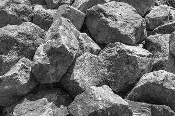 A pile of large gray stones. A lot of gray stones