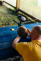 dad and son at shooting range
