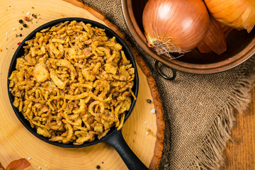 Crispy Fried Onion Strings Background. Selective focus.