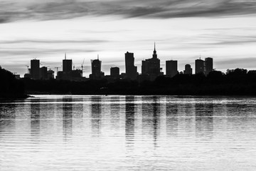 Fototapeta na wymiar Warsaw skyline with skyscrapers in the city Their reflection in the Vistula River.