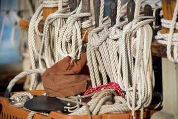 Neatly wound and stowed ropes on a sailboat