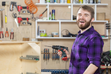 Manufacturing, Small-Sized Companies and worker concept - man working on the furniture factory