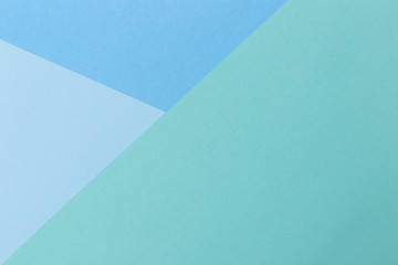 Paper blue, green, pastel empty background, geometrically located. Color blank for presentations, copy space.