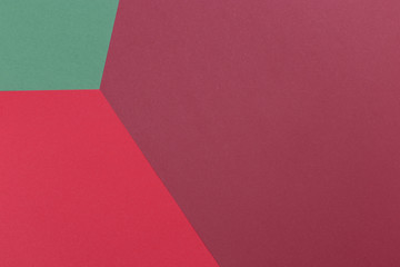 Obraz premium Paper green, burgundy, red empty background, geometrically located. Color blank for presentations, copy space.