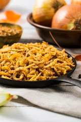 Crispy Fried Onion Strings Background. Selective focus.